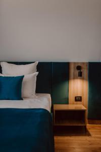 Llit o llits en una habitació de Boutique Hotel Cattaleya