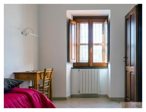 Postel nebo postele na pokoji v ubytování Monastero Santa Chiara CpF