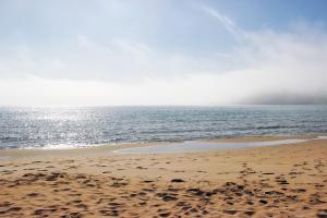 a sandy beach with the ocean in the background at Manis Sirma (fisherman's house by the Sea) in Provatas