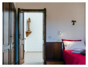 Postel nebo postele na pokoji v ubytování Monastero Santa Chiara CpF