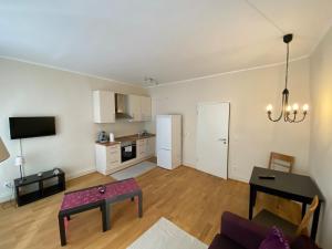 a living room with a couch and a table at Altstadt in Heidelberg