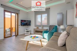 a living room with a couch and a table at Palamós Luxe Apartments in Palamós