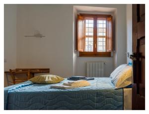 Postel nebo postele na pokoji v ubytování Monastero Santa Chiara CpF