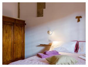 Postel nebo postele na pokoji v ubytování Monastero Santa Chiara CpF