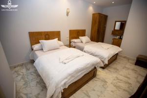 Postel nebo postele na pokoji v ubytování Life Pyramids Inn