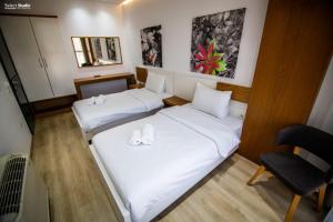 Hotel Restorant Delisia客房内的一张或多张床位