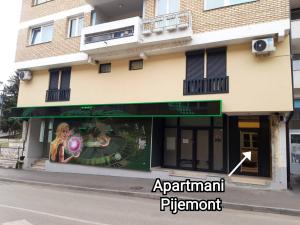 a store front of a building on a street at Apartmani Pijemont in Višegrad