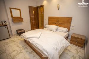 Postel nebo postele na pokoji v ubytování Life Pyramids Inn