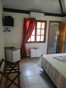 Postel nebo postele na pokoji v ubytování Pousada Alegria