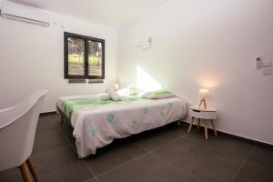 Postel nebo postele na pokoji v ubytování Caribbean’ZEN + 28 fotografií