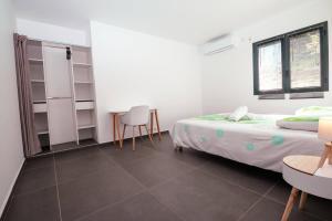 Postel nebo postele na pokoji v ubytování Caribbean’ZEN
