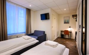 Postel nebo postele na pokoji v ubytování Go Hotel Saga