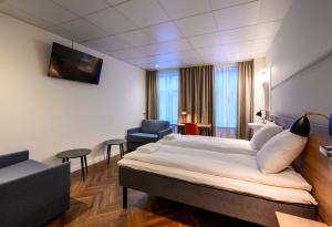 Postel nebo postele na pokoji v ubytování Go Hotel Saga
