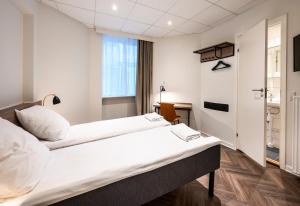 Postel nebo postele na pokoji v ubytování Go Hotel Saga