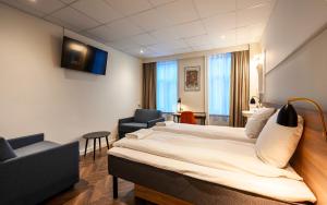 TV a/nebo společenská místnost v ubytování Go Hotel Saga