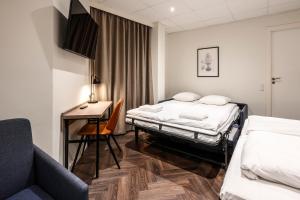 Postel nebo postele na pokoji v ubytování Go Hotel Saga