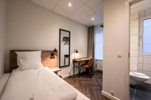 Postel nebo postele na pokoji v ubytování Go Hotel Saga