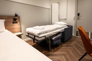 Postel nebo postele na pokoji v ubytování Go Hotel Saga