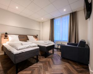 Postel nebo postele na pokoji v ubytování Go Hotel Saga