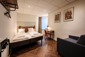 Postel nebo postele na pokoji v ubytování Go Hotel Saga