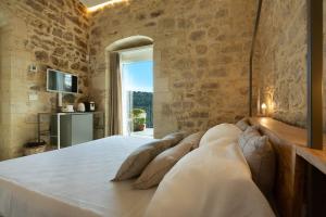 Postel nebo postele na pokoji v ubytování Innesti B&B + 20 fotografií