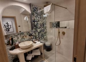 a bathroom with a sink and a shower at Hotel delle Rose in Porto Cervo