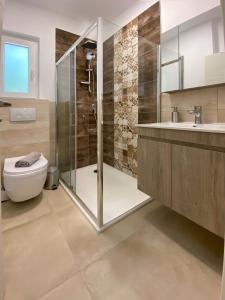 Koupelna v ubytování ANEMOMYLOS Lefkimmi LUXUS SUITES-BOUTIQUE HOTEL & POOL