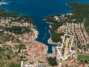 an aerial view of a town next to a body of water at Apartment Marinetto in Stari Grad +15 photos