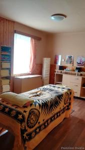 Ένα ή περισσότερα κρεβάτια σε δωμάτιο στο Penzion Dukla