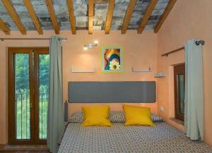 Postel nebo postele na pokoji v ubytování Dolce Vita in Tuscany B&B