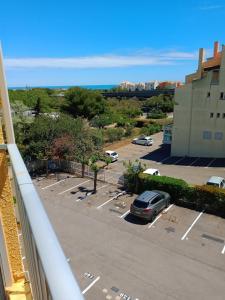 a view of a parking lot with a car parked at Studio Cap d'Agde le Môle in Cap d'Agde
