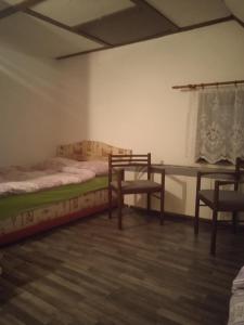 A bed or beds in a room at Chalupa Bob a Bobek