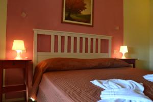Letto o letti in una camera di Albergo Umbria