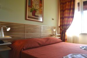 Letto o letti in una camera di Albergo Umbria