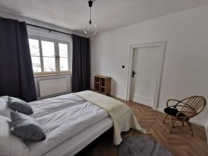 Posteľ alebo postele v izbe v ubytovaní Apartament Black&White
