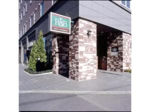 a facade of a building with a sign on it at R&B Hotel Kumagaya Ekimae - Vacation STAY 40476v in Kumagaya +9 photos
