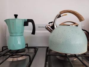 a teapot sitting on top of a stove at Aguadilla Sunrise apt with AC WIFI 8 minute walk from Crashboat beach in Aguadilla