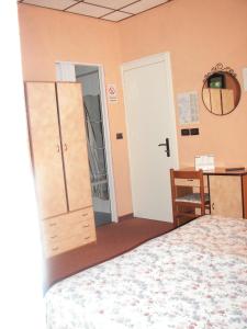 Postel nebo postele na pokoji v ubytování Albergo Sangrilà