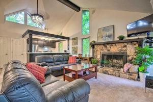 a living room with a couch and a fireplace at Osage Beach Getaway - 1 Mi to Margaritaville Fun! in Osage Beach