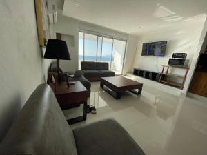 Μια τηλεόραση ή/και κέντρο ψυχαγωγίας στο INCREIBLE DEPARTAMENTO A PIE DE PLAYA EN MANZANILLO, COMPLETAMENTE NUEVO