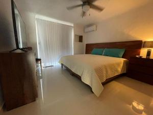 Ένα ή περισσότερα κρεβάτια σε δωμάτιο στο INCREIBLE DEPARTAMENTO A PIE DE PLAYA EN MANZANILLO, COMPLETAMENTE NUEVO +38 φωτογραφίες