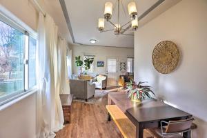 a living room with a table and a couch and a window at 1/2 Mi to Tennyson: Pet-Friendly Denver Gem in Denver