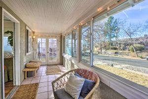 a screened porch with a chair and windows at 1/2 Mi to Tennyson: Pet-Friendly Denver Gem in Denver