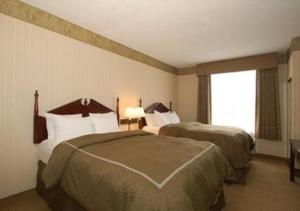 Llit o llits en una habitació de Comfort Suites McAlester