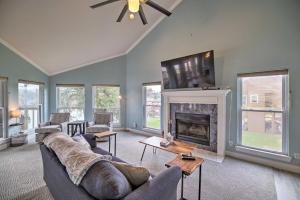 a living room with a couch and a fireplace at Waterfront San Jacinto River Home with Boat Slip! in Houston