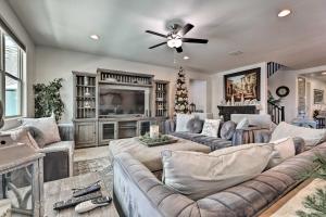a large living room with couches and a ceiling fan at San Tan Valley Gem with Private Pool and Hot Tub! in Queen Creek