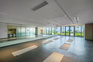 a large room with yoga mats on the floor at The Yun Resort Shenzhen Longcheer in Shenzhen