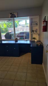 a kitchen with a blue counter and a window at Beautiful Casa Del Sol in Hollywood