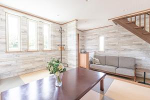 a living room with a couch and a table at Seaside House Yasutaketei in Shirahama +31 photos