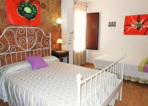 Cama o camas de una habitación en Casa Rural Jardín del Desierto